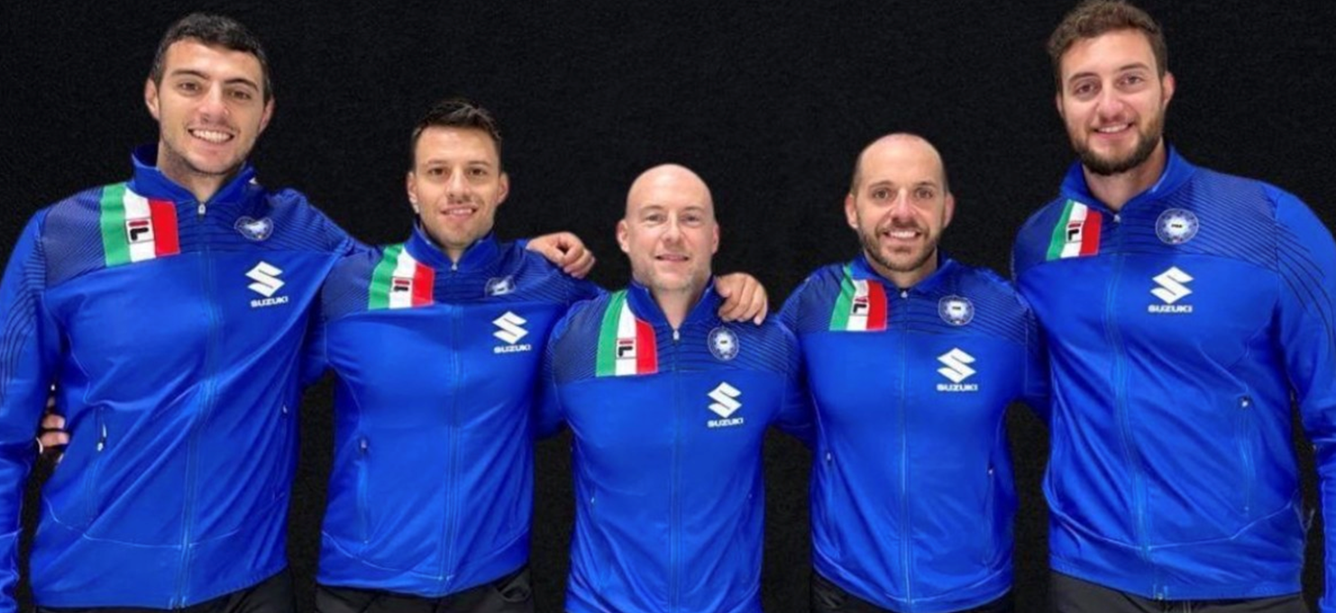 Canada's 2014 Olympic men's curling champion Ryan Fry, centre, with the Italian team he will now coach for the home Winter Olympics at Milan Cortina in 2026 ©FISG