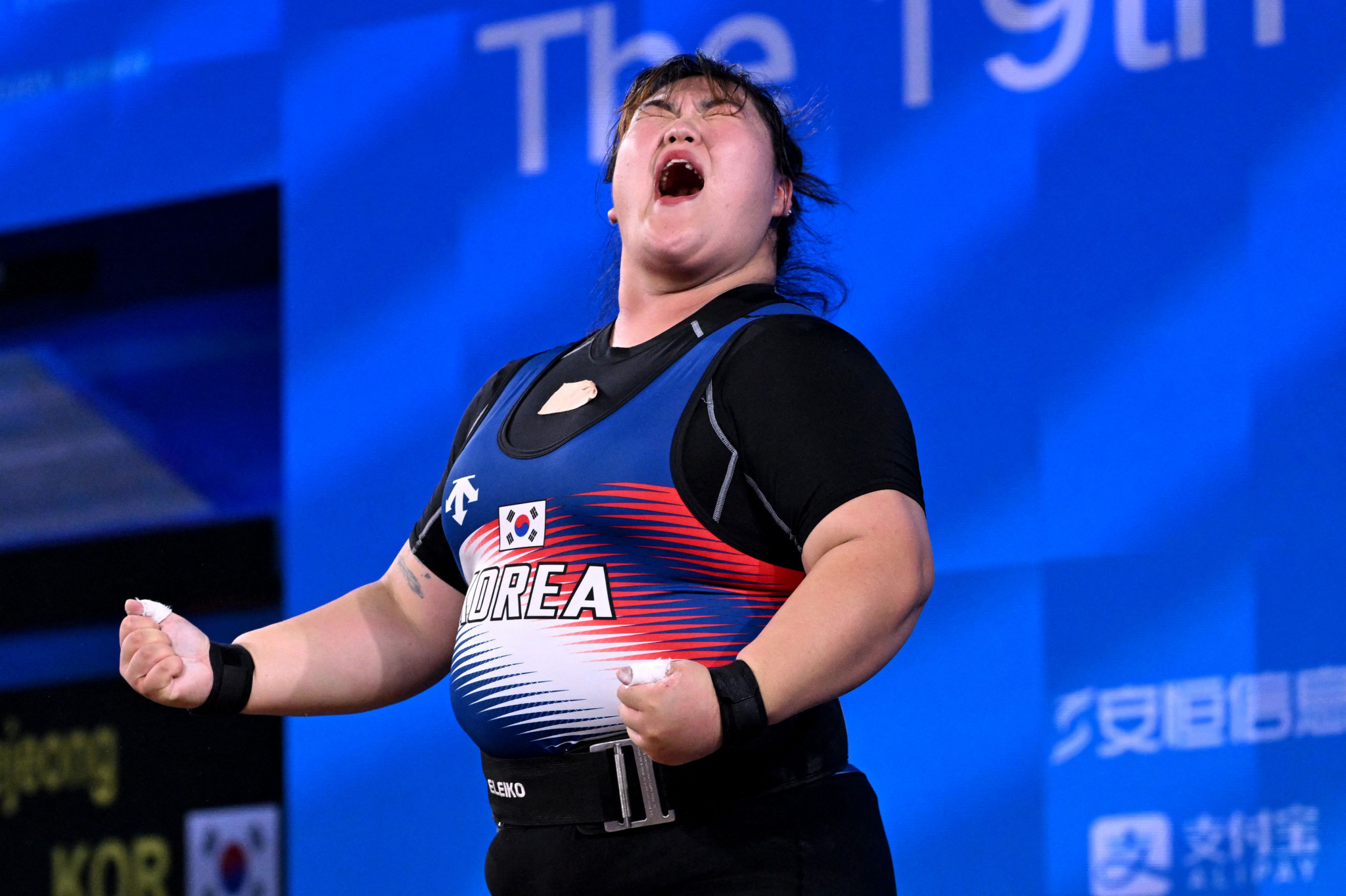 Park Hye-jeong of South Korea reacts while competing in the women's over-87kg weightlifting final ©Getty Images