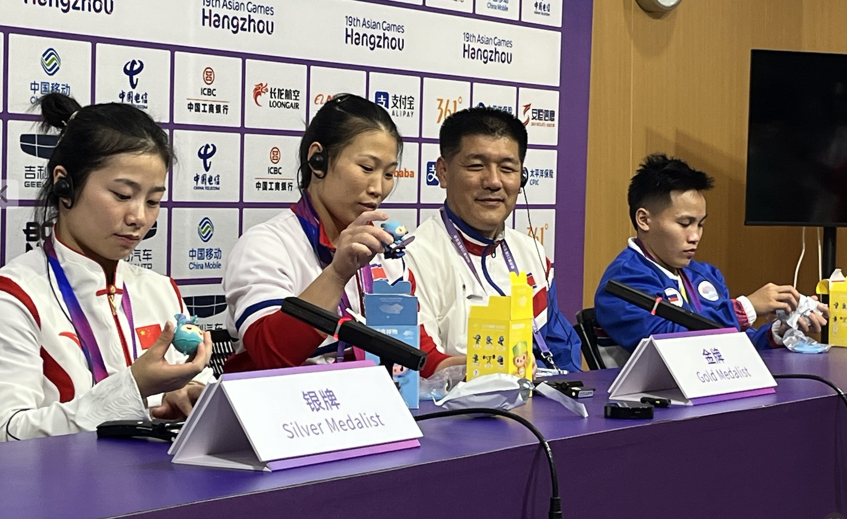 All but one of North Korea's 13 weightlifting medallists sat down to speak to the media following their performances in Hangzhou ©Getty Images