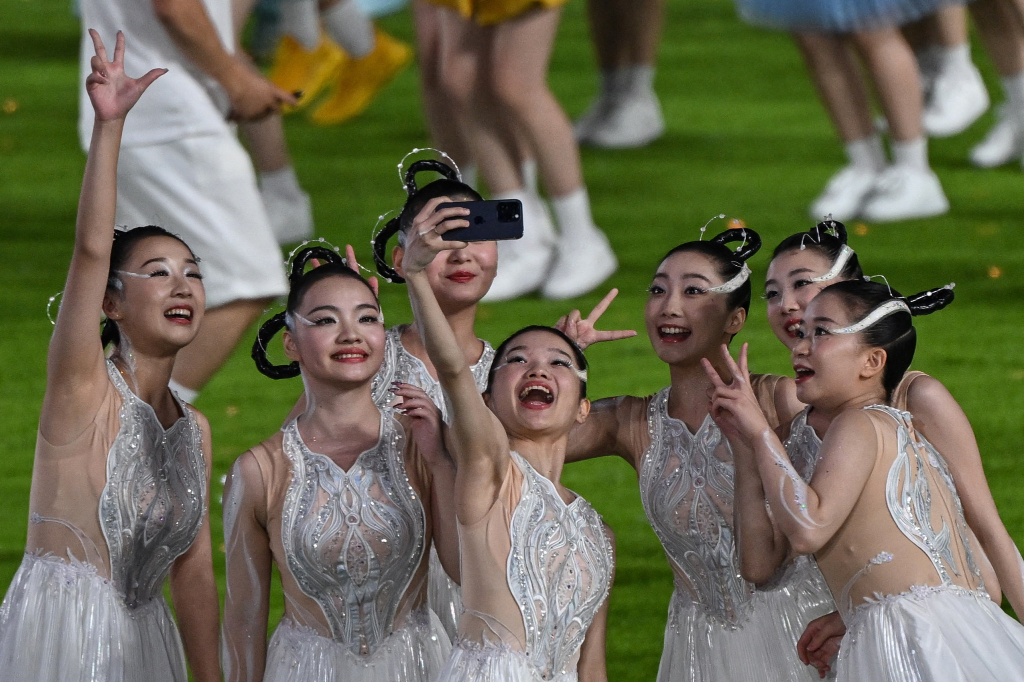 Performers enjoy their moment at the Hangzhou Olympic Sports Centre Stadium ©Getty Images