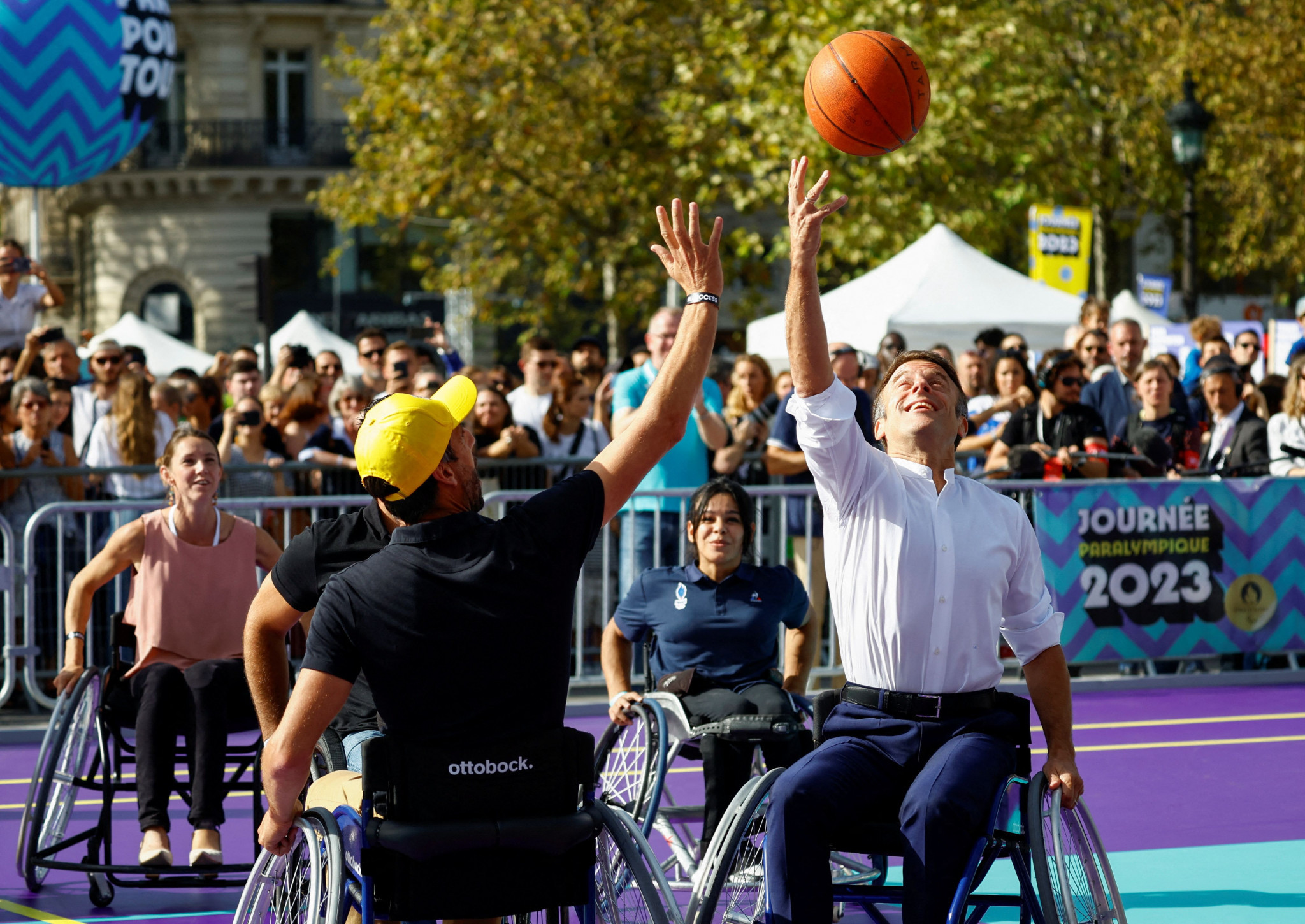 French President Emmanuel Macron, right, took part in a wheelchair basketball game on Paralympic Day ©Getty Images