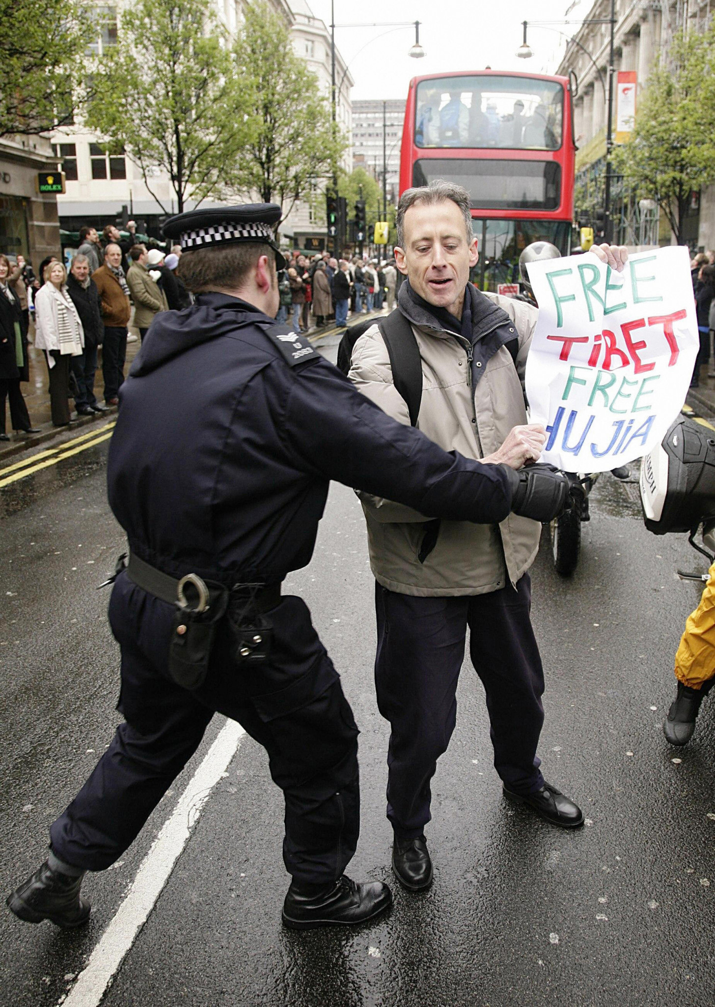 Peter Tatchell, right, previously attempted to disrupt the Beijing 2008 Olympic Torch Relay in London in protest against China's human rights record ©Getty Images
