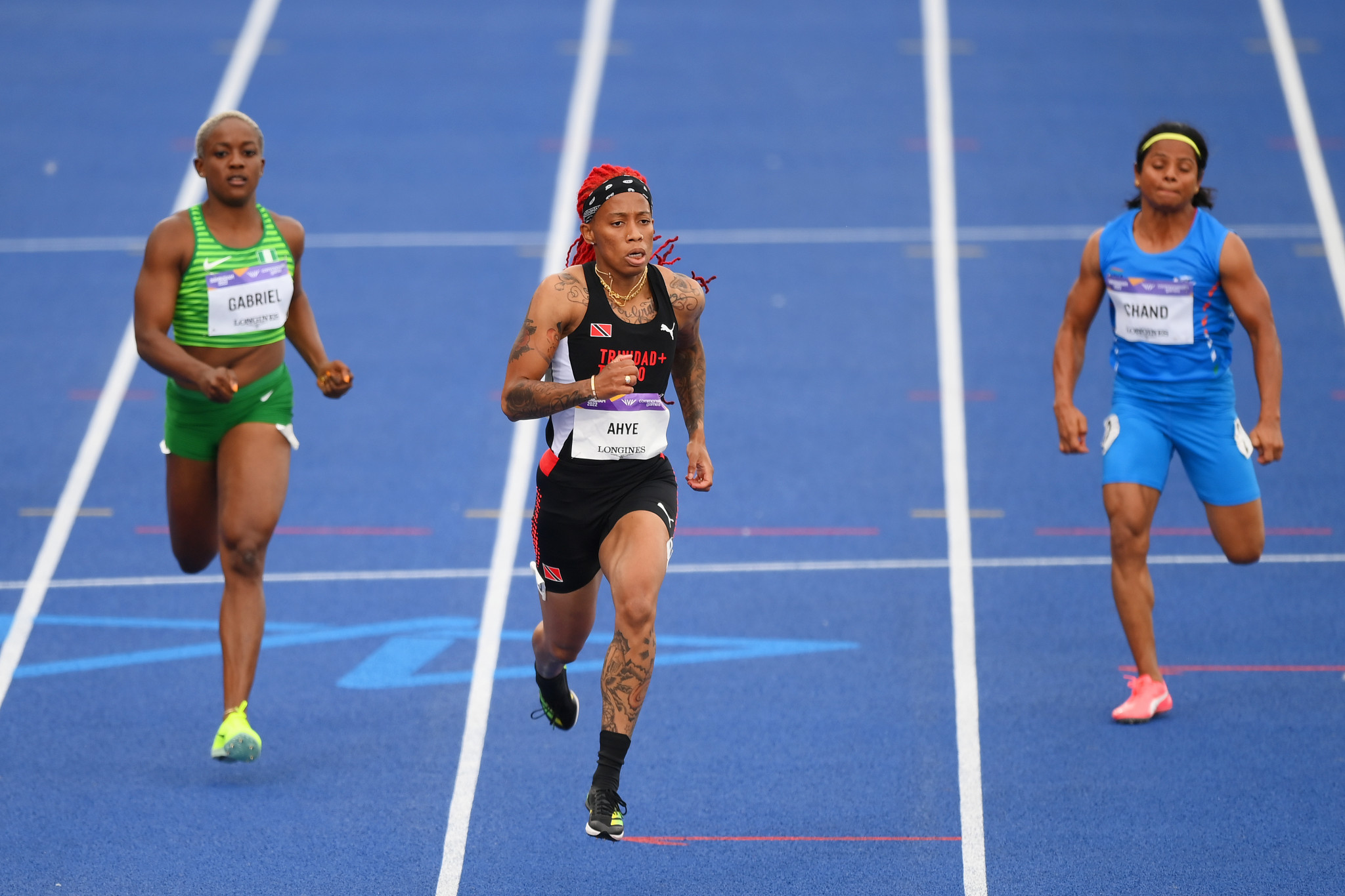 Michelle-Lee Ahye, centre, will hope to upgrade from her 100m silver from four years ago ©Getty Images