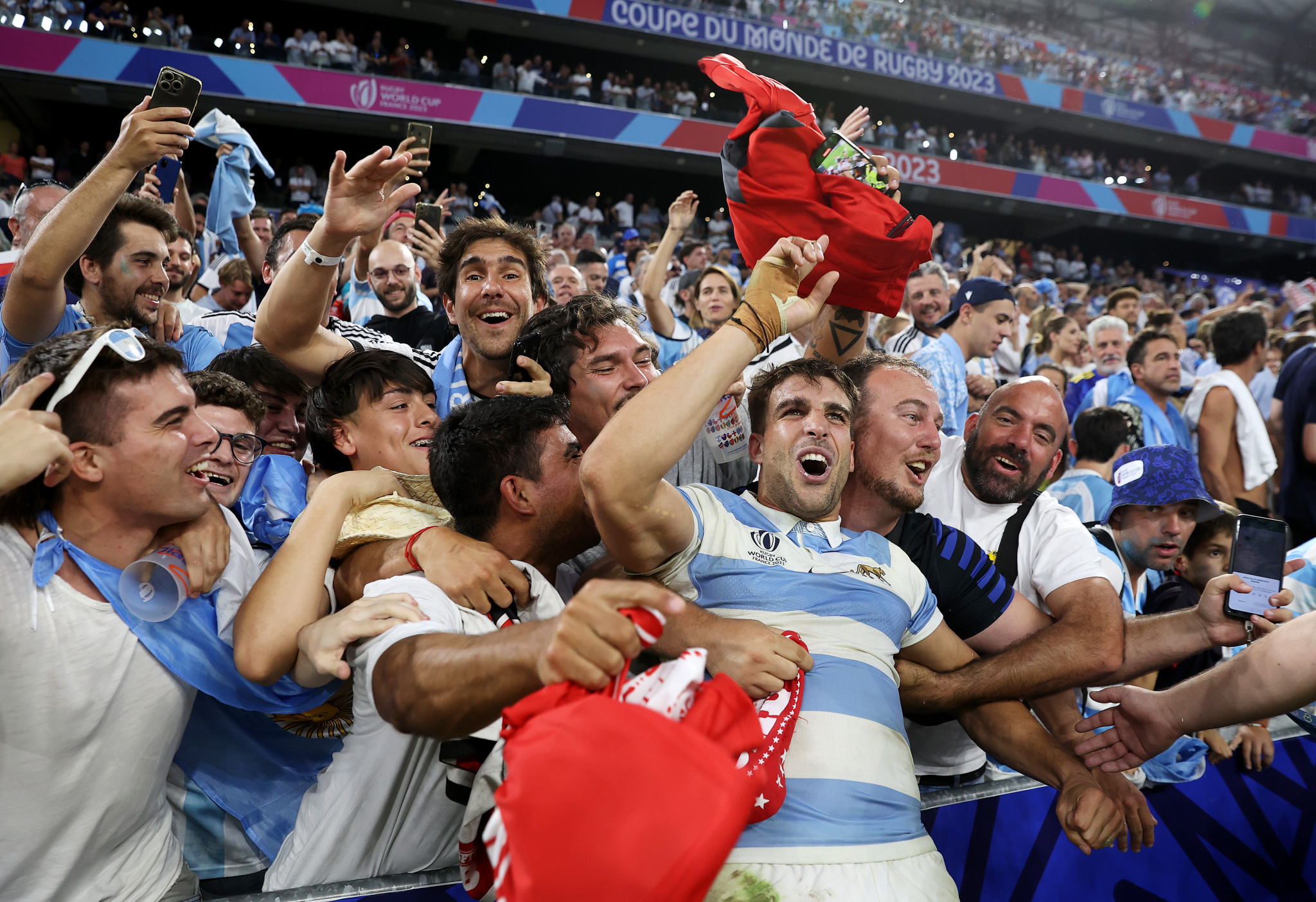 Juan Cruz Mallia celebrates with Argentina's fans after their victory against Wales ©Getty Images