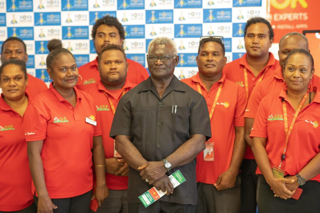 Solomon Islands Prime Minister Manasseh Sogavare, centre, was the first to purchase tickets  ©Sol2023