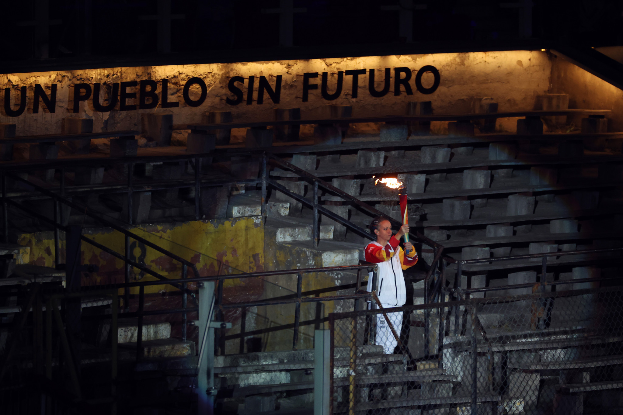 The Santiago 2023 Flame arrived under a banner recalling the dark days of military dictatorship in Chile ©Getty Images