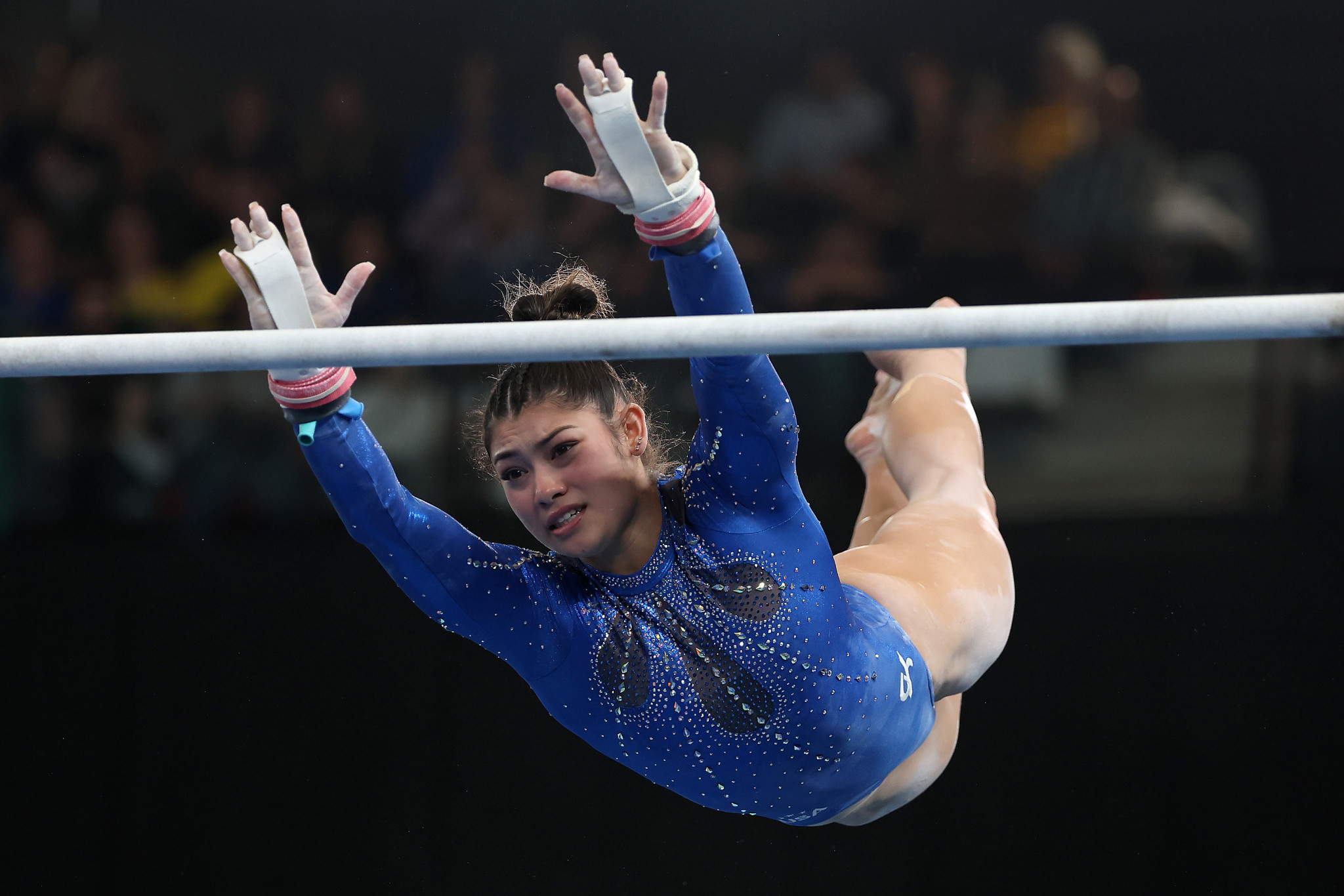 Kayla DiCello on the uneven bars as part of her women's all-around gold medal performance ©Getty Images 