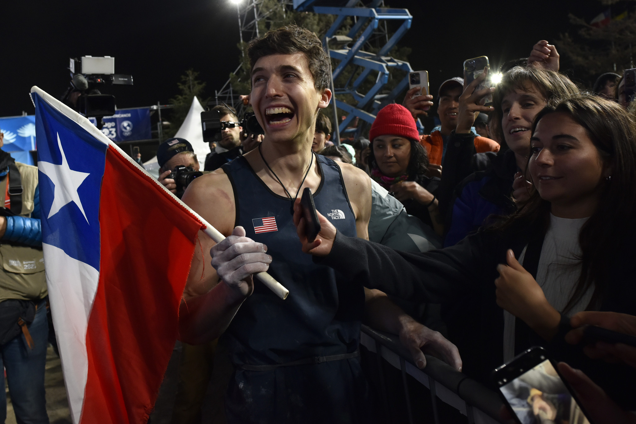 American climber Jesse Grupper is given a Chilean flag after his gold medal win ©Getty Images 