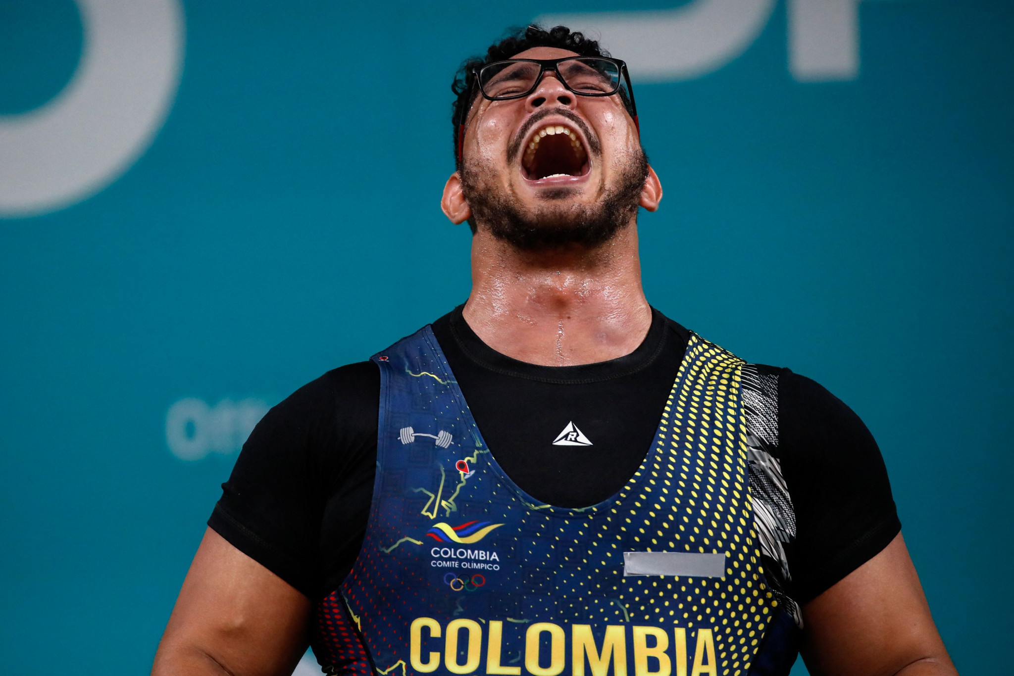 Gold medallist Rafael Cerro roars while competing in the men's over-102kg weightlifting ©Getty Images