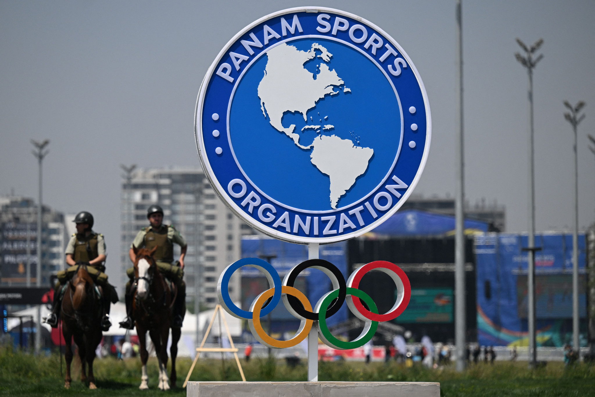 Mounted officers are seen next to the Olympic Rings and the Panam Sports logo ©Getty Images