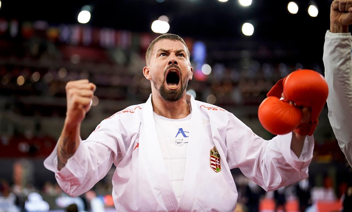 Hungary’s Gábor Hárspataki roars with delight after guaranteeing the host nation's first medal by reaching the men's under-75kg final ©WKF