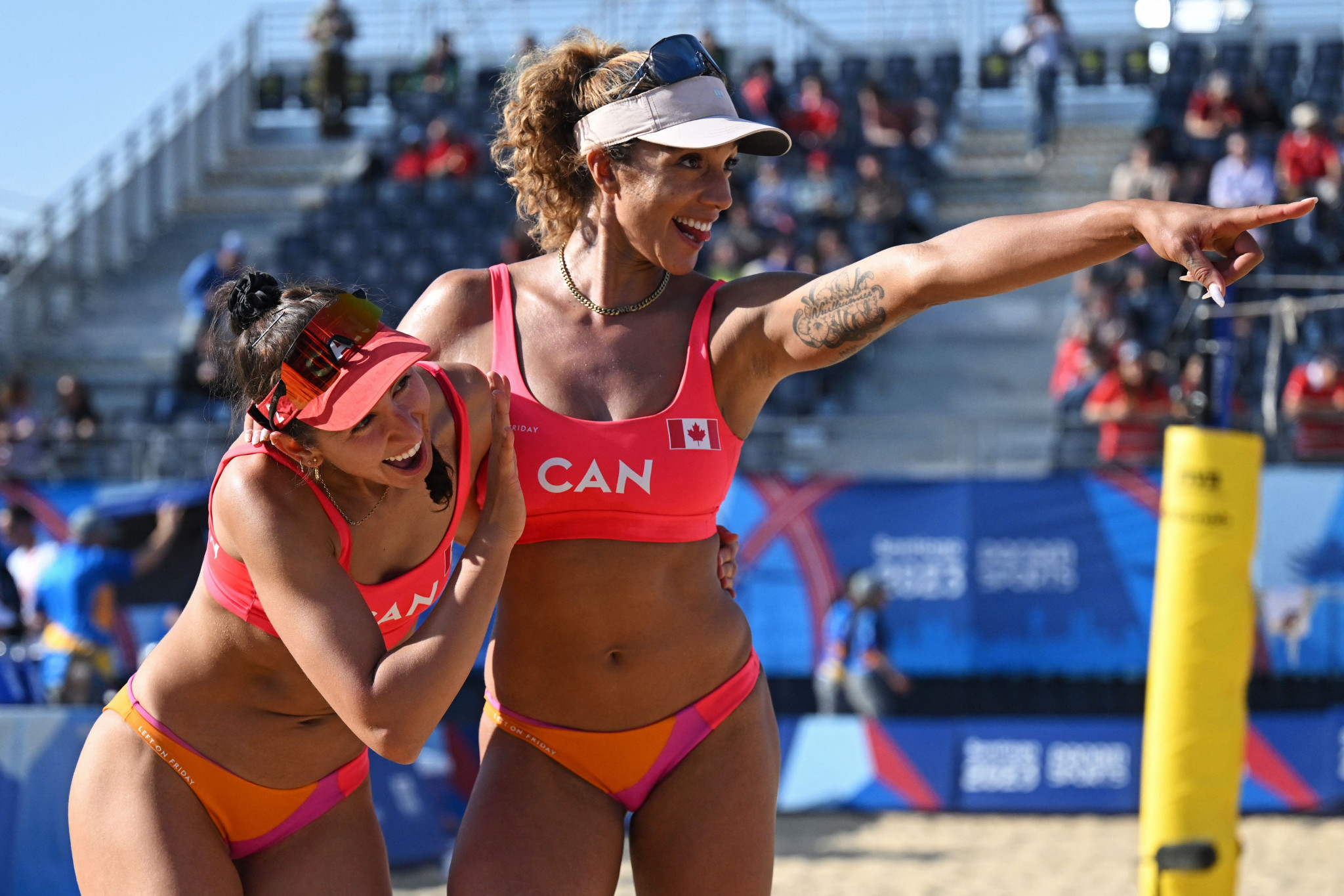Melissa Humana-Paredes and Brandie Wilkerson of Canada celebrate reaching the beach volleyball final  ©Getty Images