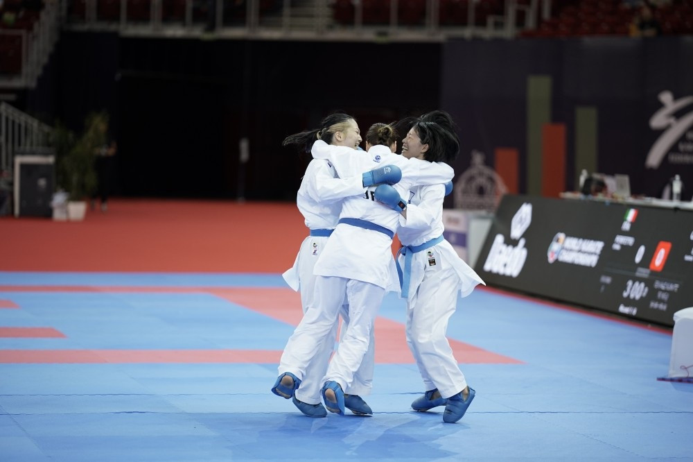 Japan celebrate reaching the women's team kumite final ©WKF