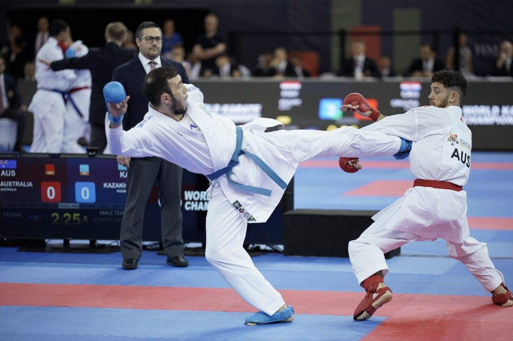Kazakhstan and Australia lock horns during an entertaining men's team kumite competition ©WKF