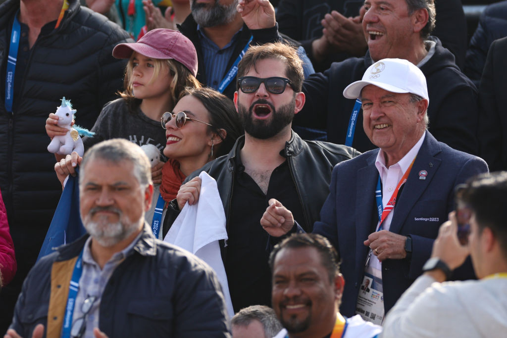 Chilean President Gabriel Boric reacts while watching the beach volleyball at the Pan American Games in Santiago ©Getty Images