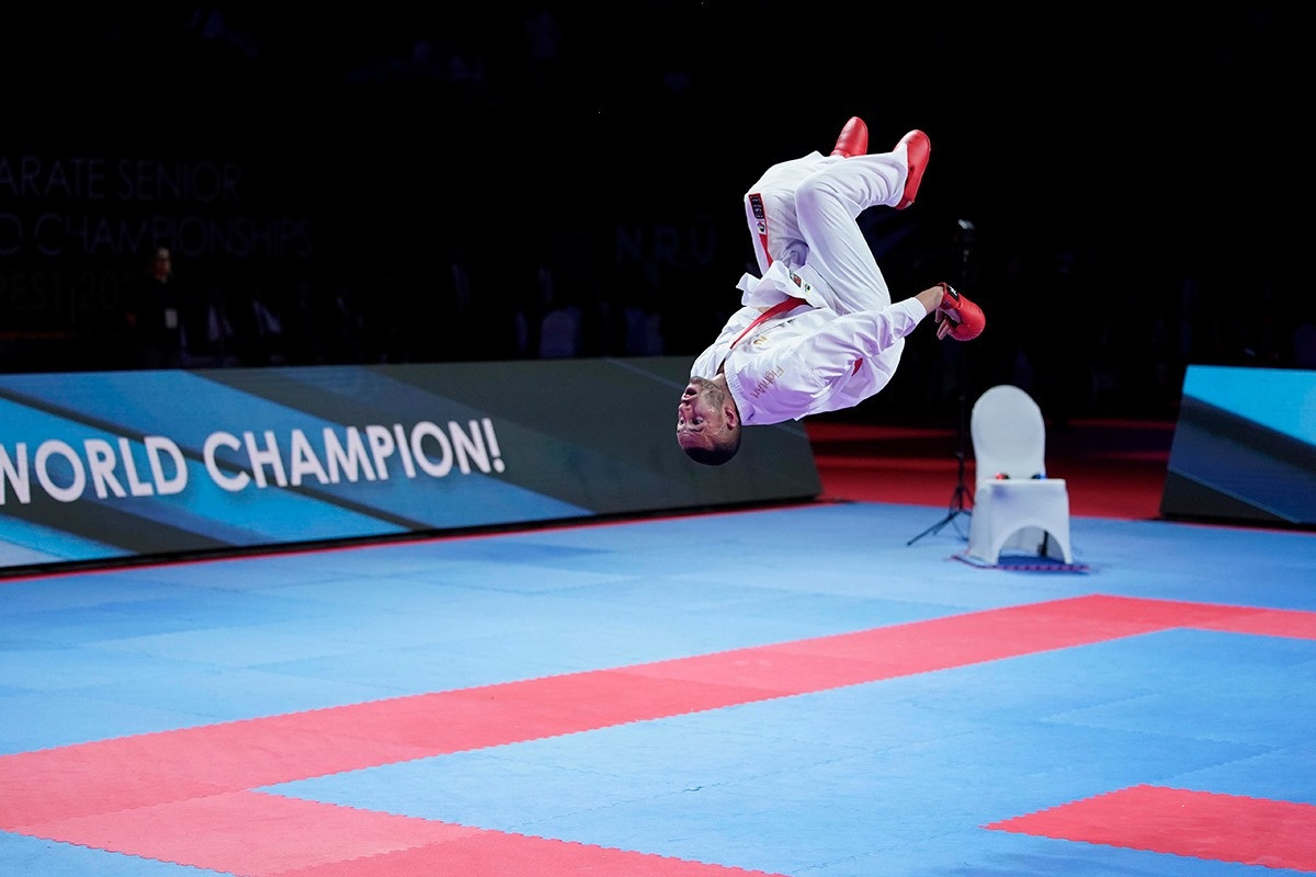 France’s Olympic champion Steven Da Costa  produces a backflip following his dramatic victory to seal a hat-trick of men's under-67kg crowns ©WKF
