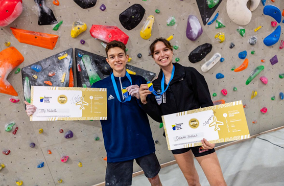 Toby Roberts, left, and Oriane Bertone celebrate earning Paris 2024 spots after winning the boulder and lead European qualifier in Laval ©IFSC