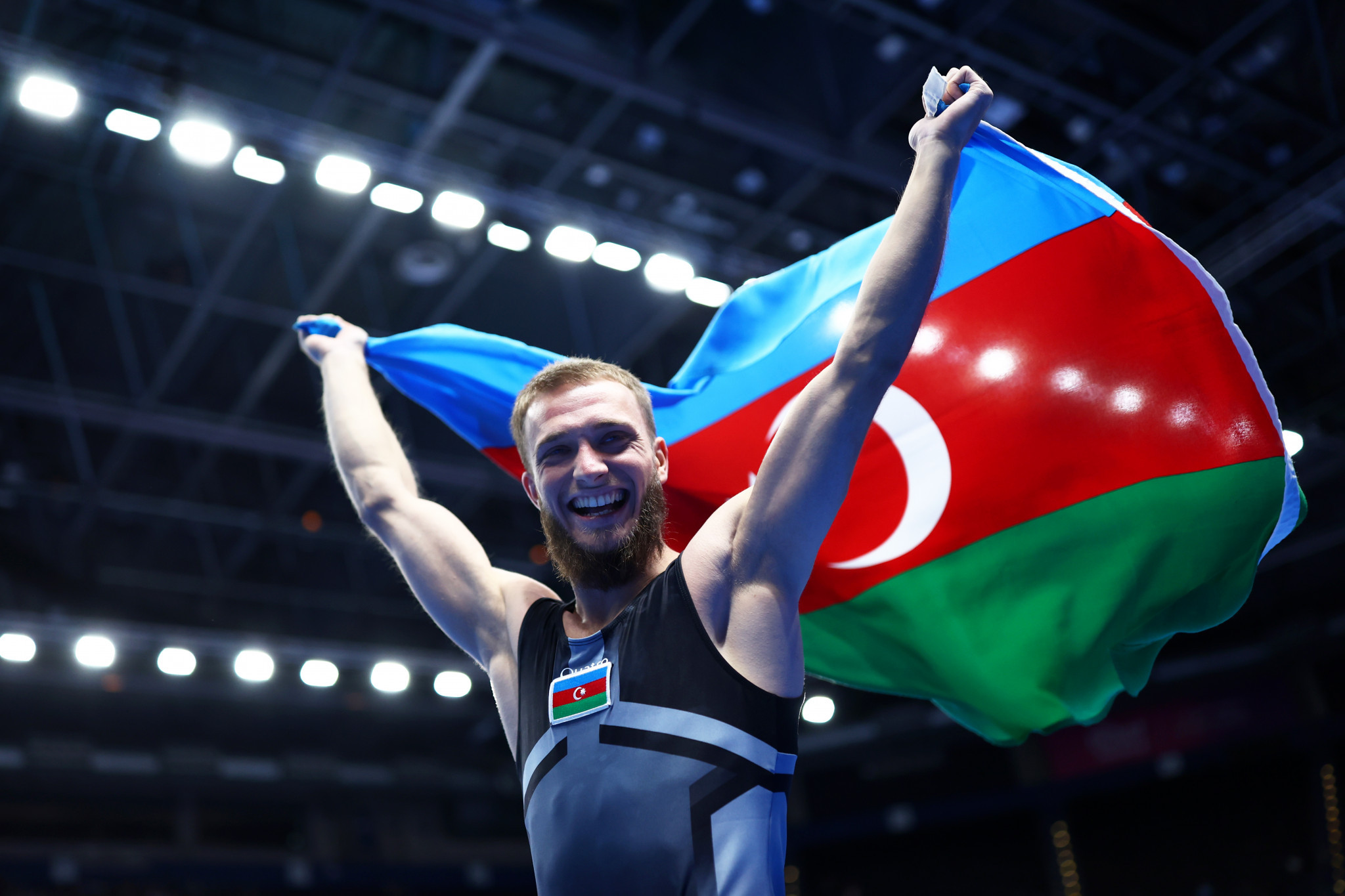 Malkin Mikhail of Azerbaijan celebrates after winning the gold medal in the Men's Tumble Final on day three of the 37th FIG Trampoline Gymnastics World Championships at Utilita Arena in Birmingham ©Getty Images