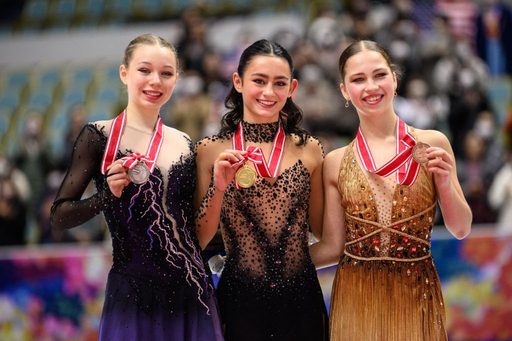 Silver medallist USA's Lindsay Thorngren, gold medallist USA's Ava Marie Ziegler and bronze medallist Belgium's Nina Pinzarrone attend the medal ceremony for the women free skating during ISU Grand Prix of Figure Skating NHK Trophy in Kadoma city of Osaka Prefecture on November 25, 2023. (Photo by Philip FONG / AFP) (Photo by PHILIP FONG/AFP via Getty Images)
