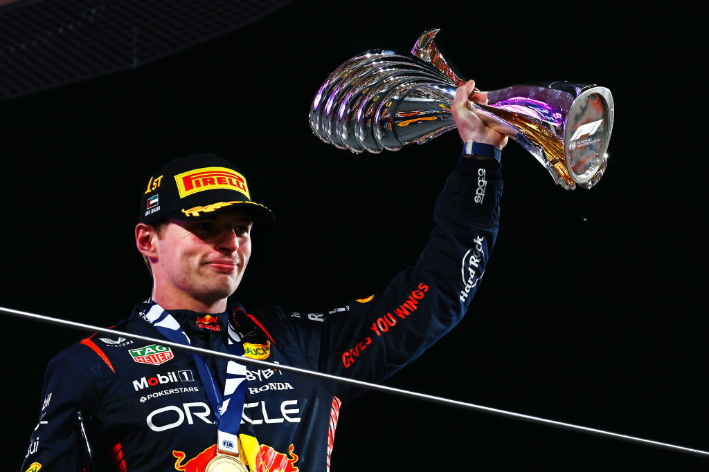 Race winner Max Verstappen of the Netherlands and Oracle Red Bull Racing celebrates on the podium during the F1 Grand Prix of Abu Dhabi at Yas Marina Circuit on November 26, 2023 in Abu Dhabi, United Arab Emirates. (Photo by Mark Thompson/Getty Images)