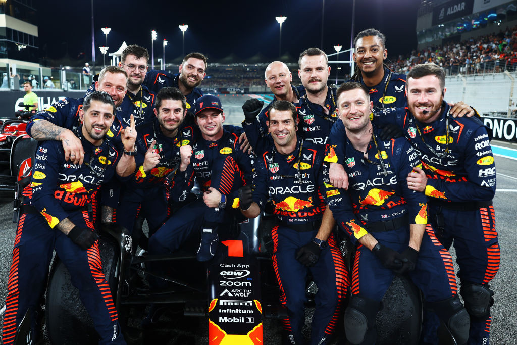 Race winner Max Verstappen of the Netherlands and Oracle Red Bull Racing poses for a photo with his team in parc ferme during the F1 Grand Prix of Abu Dhabi at Yas Marina Circuit on November 26, 2023 in Abu Dhabi, United Arab Emirates. (Photo by Mark Thompson/Getty Images)