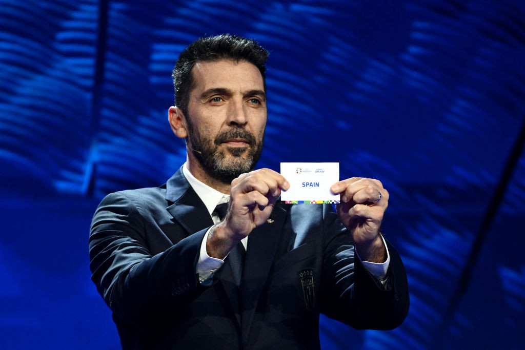HAMBURG, GERMANY - DECEMBER 02: Special guest Gianluigi Buffon​ pulls out the card of Spain during the UEFA EURO 2024 Final Tournament Draw at Elbphilharmonie on December 02, 2023 in Hamburg, Germany. (Photo by Alexander Scheuber/Getty Images)
