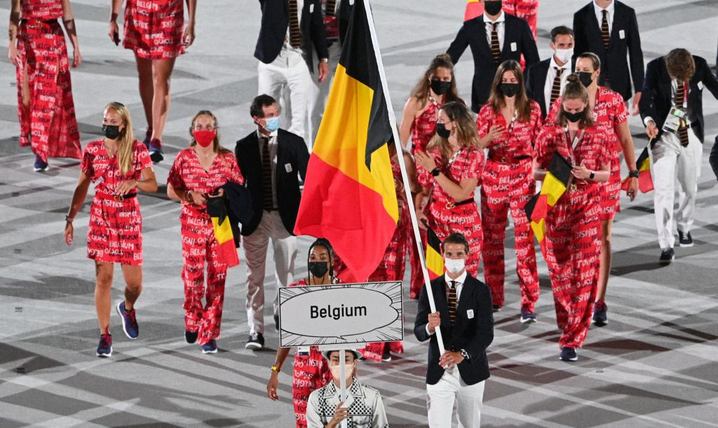 Belgium's flag bearer Nafissatou Thiam (L) and Belgium's flag bearer Felix Veronique B. Denayer lead the delegation during the opening ceremony of the Tokyo 2020 Olympic Games, at the Olympic Stadium, in Tokyo, on July 23, 2021. (Photo by Martin BUREAU / AFP) (Photo by MARTIN BUREAU/AFP via Getty Images)

