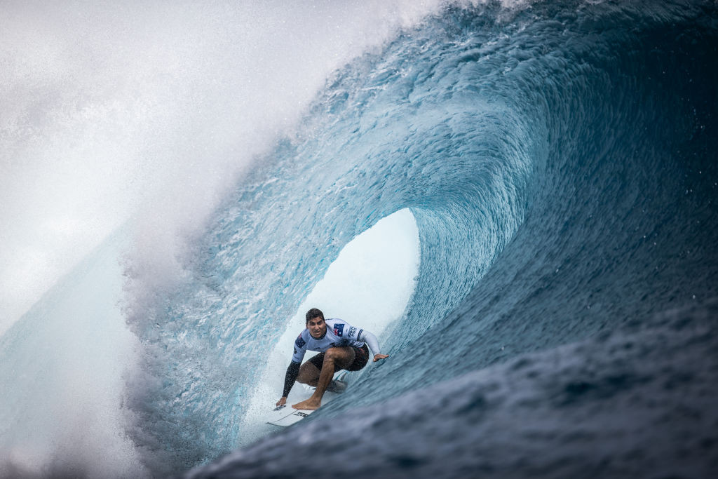 Australian Callum Robson surfs a barrel wave in Teahupo'o. © Getty Images
