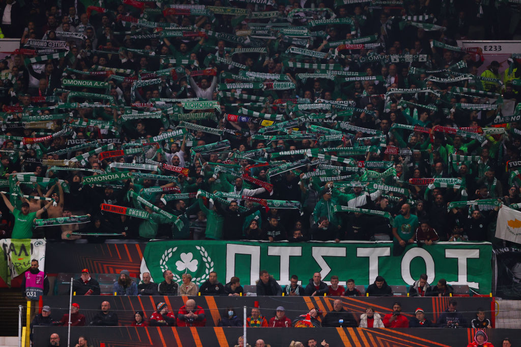 Omonia supporters lift up banners during the UEFA Europa League group E match between Manchester United and Omonia Nikosia at Old Trafford. © Getty Images