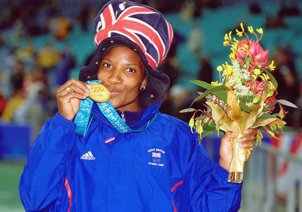Denise Lewis celebrates gold in the heptathlon at the 2000 Sydney Olympics. ALLSPORT
