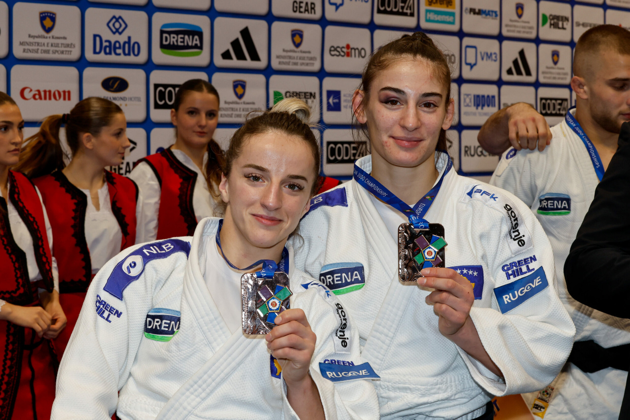 Distria Krasniqi (from the left) and Nora Gjakova after the award ceremony at the European Championships Open in Pristina © EJU Media