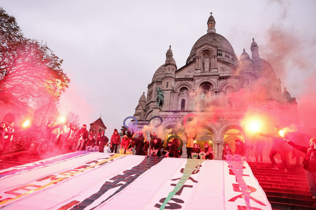 On the steps of the Basilica of the Sacré Coeur, demonstrators lit sparklers and unfurled banners. GETTY IMAGES