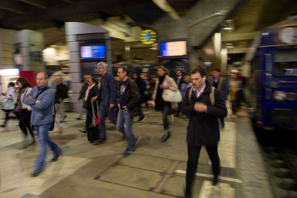 People walk on a platform at Gare Montparnasse railway station in Paris. GETTY IMAGES