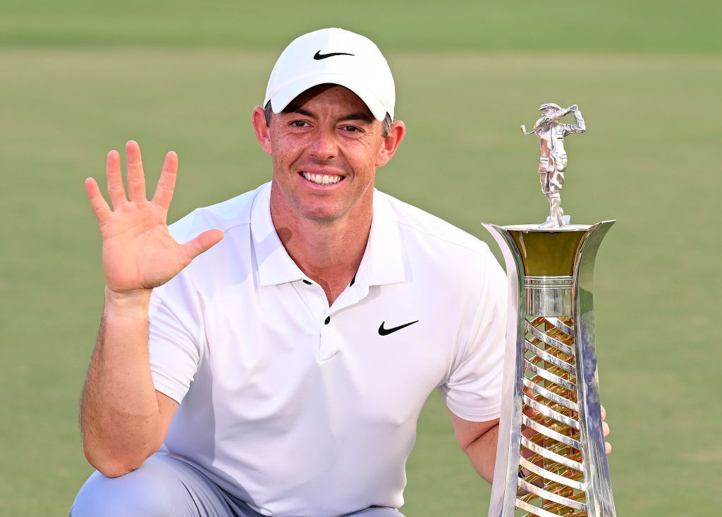  Rory McIlroy of Northern Ireland poses with the Race to Dubai trophy. GETTY IMAGES