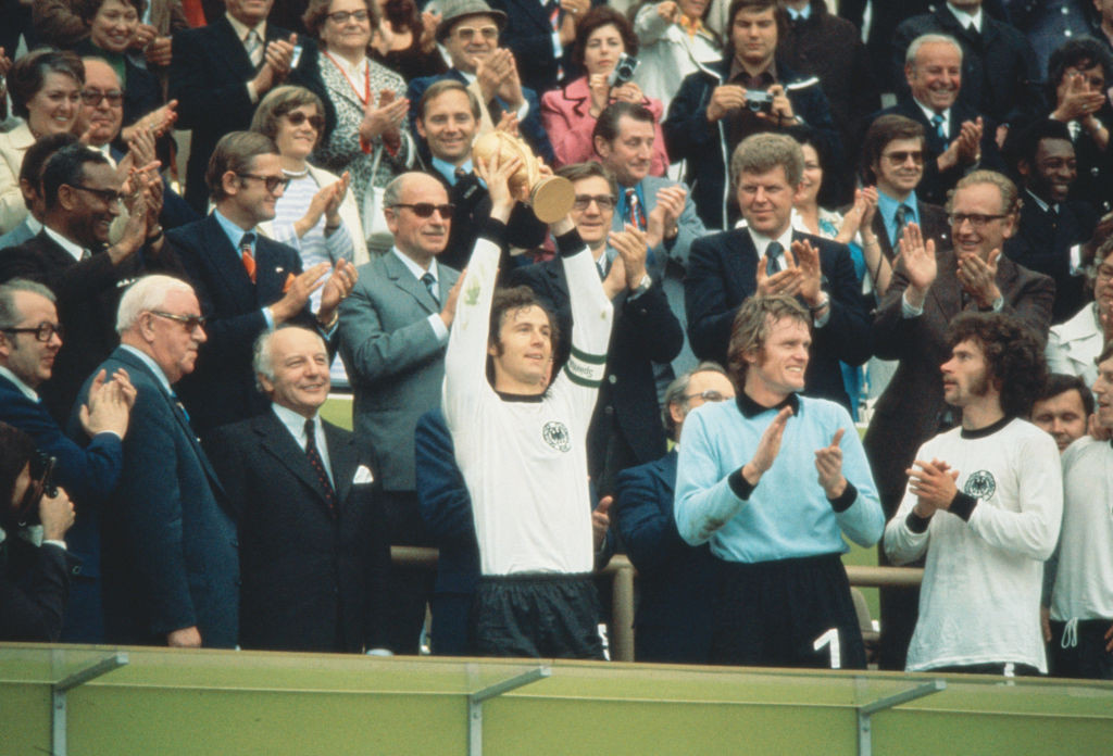 Franz Beckenbauer lifts the World Cup trophy as captain of West Germany in 1972. GETTY IMAGES
