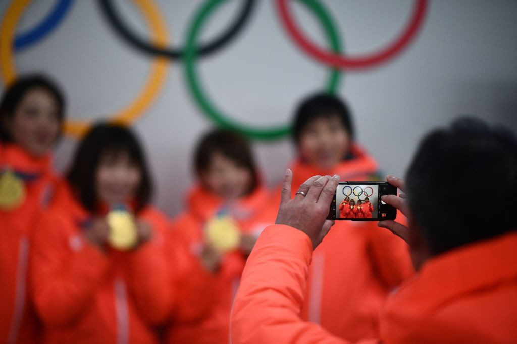 Olympic athletes can upload photos and videos to social media, but not live or AI