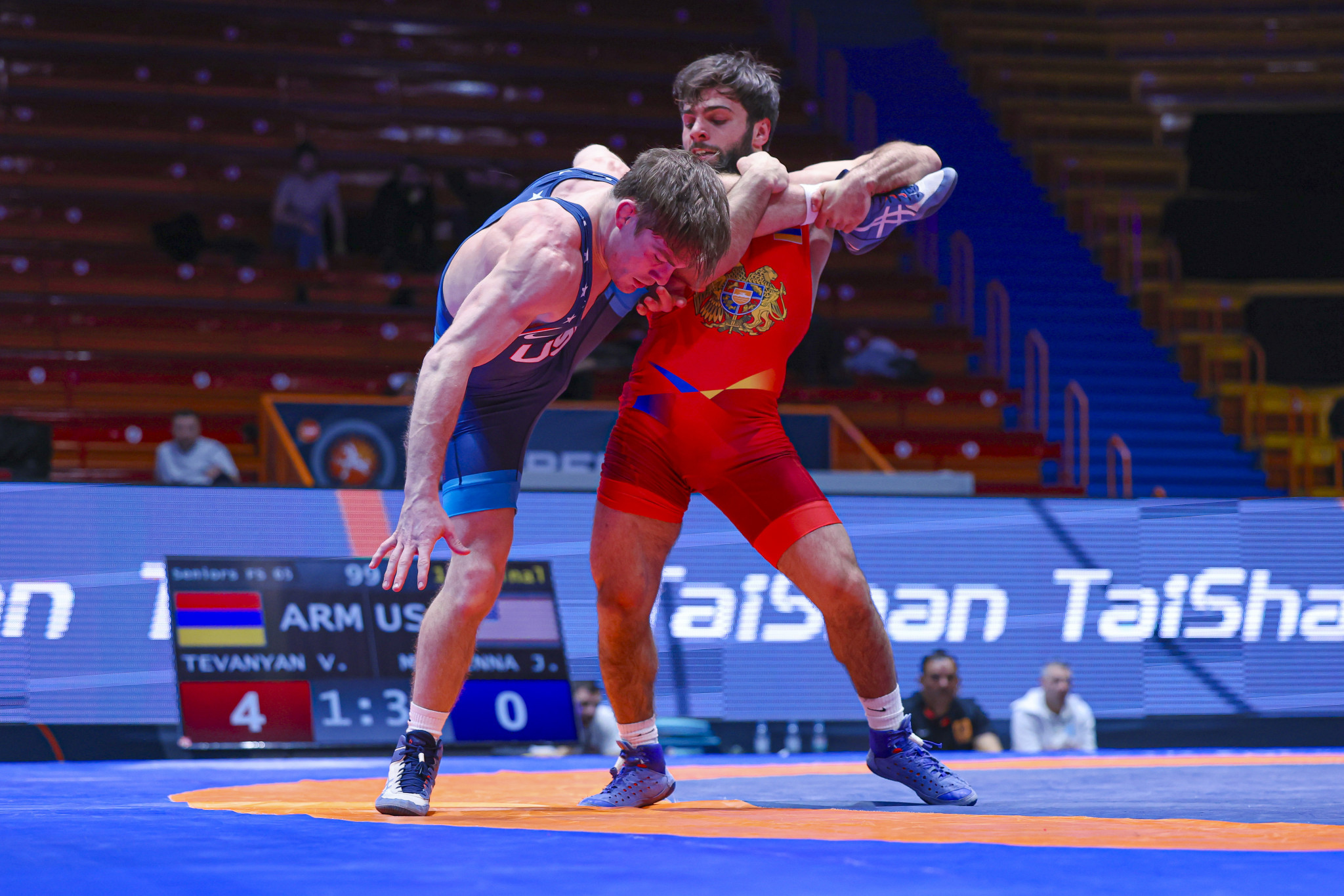 Vazgen Tevanyan (Armenia) scores on Joseph McKenna (USA) in the quarter-finals of the -65kg category. UWW