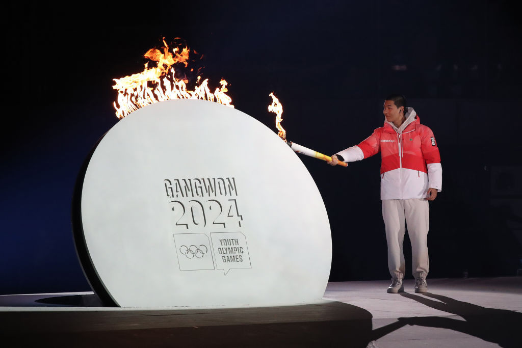 Lee Jeong-min of South Korea lights the cauldron during the Gangwon 2024 Opening Ceremony. GETTY IMAGES