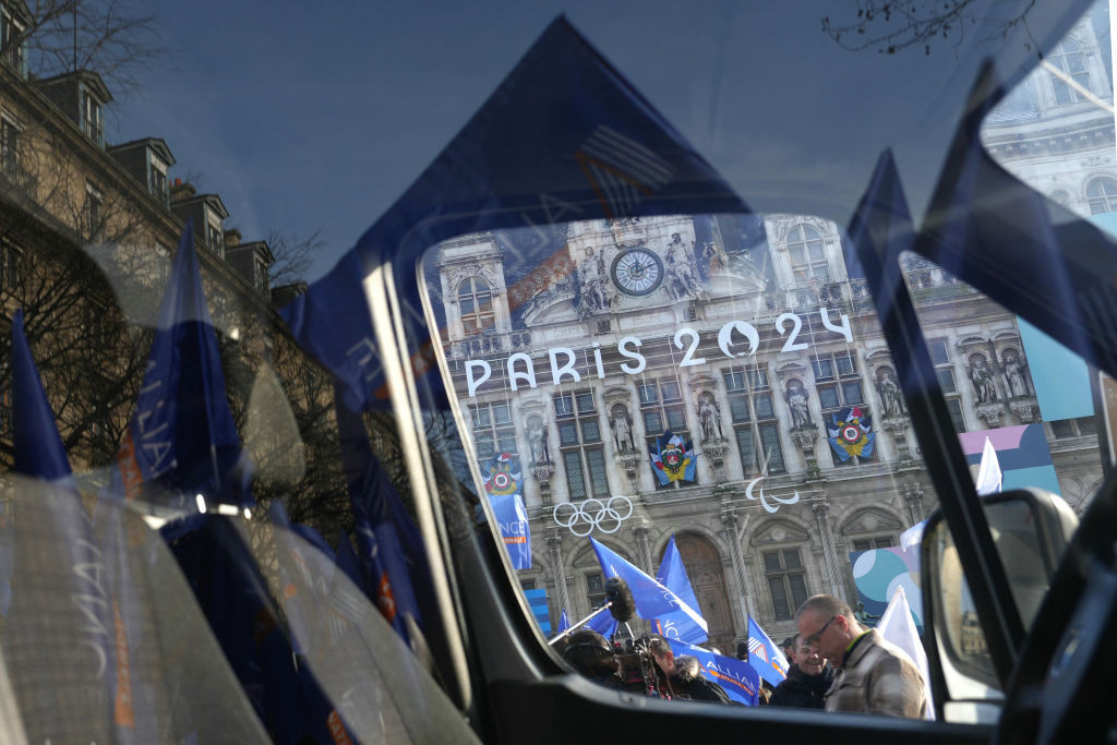 Police officers wave unions flags in front of Paris' Hotel de Ville. GETTY IMAGES