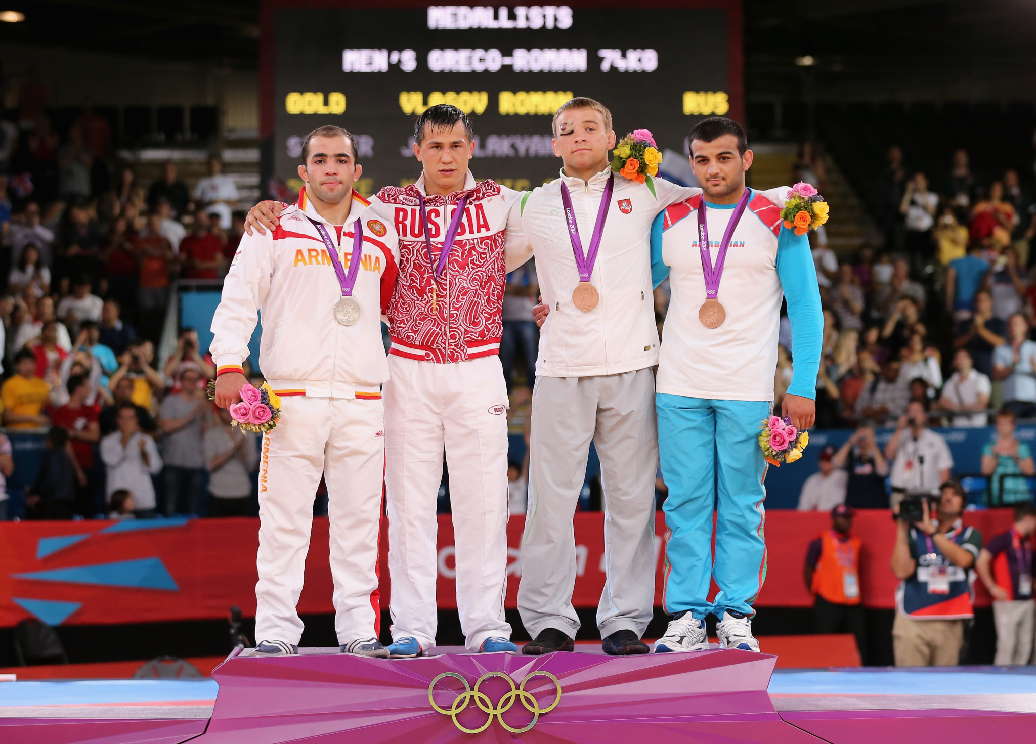 Arsen Julfalakyan (left) with his 74kg Greco-Roman silver medal at London 2012. GETTY IMAGES