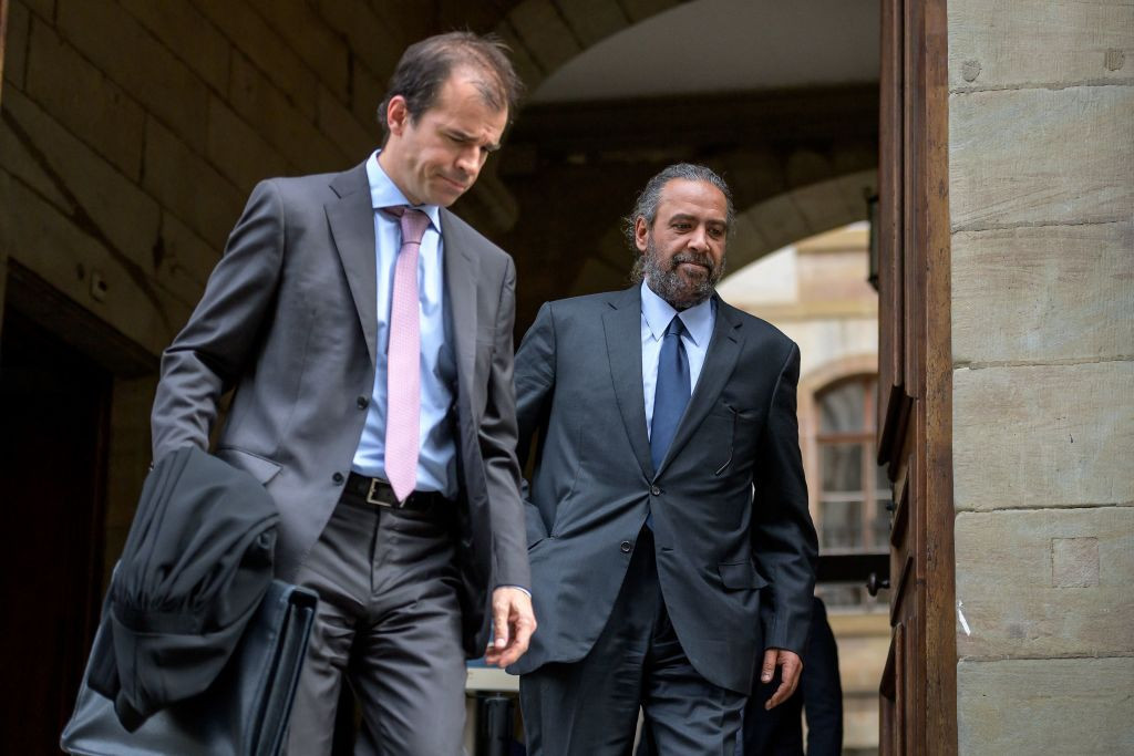 Sheikh Ahmad al-Fahad al-Sabah (C) leaves the Geneva court with his lawyer Albert Righini. GETTY IMAGES 