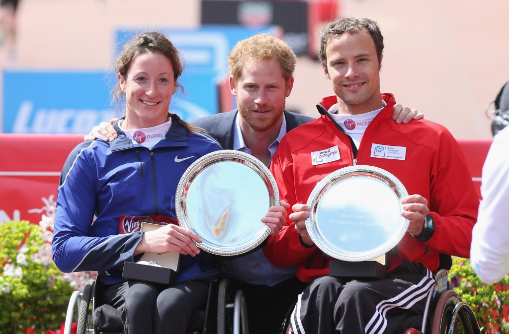 Marcel Hug (right) and Tatyana McFadden (left) pose with Prince Harry after their respective victories ©Getty Images