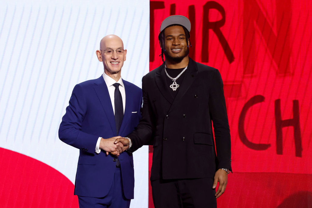 Adam Silver with young prospect Cam Withmore, 19, now with the Houston Rockets. GETTY IMAGES