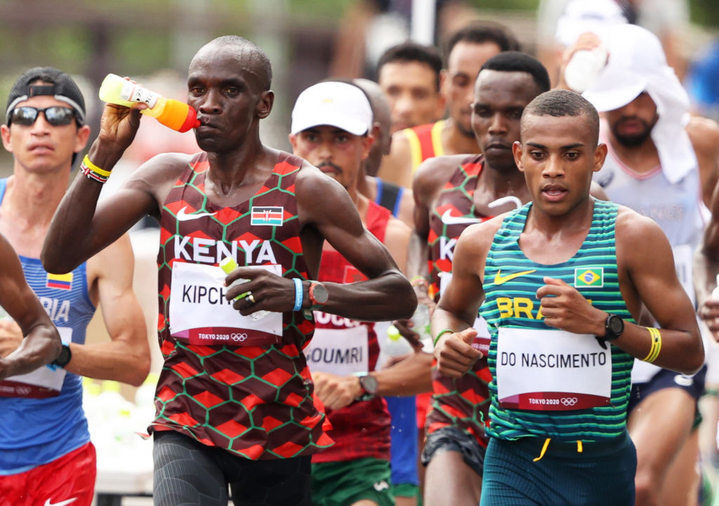 Kenya's Eliud Kipchoge of Team Kenya hydrates before winning gold in the marathon at Tokyo 2020. GETTY MAGES