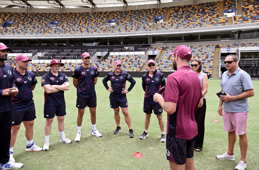 Hugo Burdon of Queensland is presented with his cap by team mate Michael Neser of Queensland at The Gabba. GETTY IMAGES