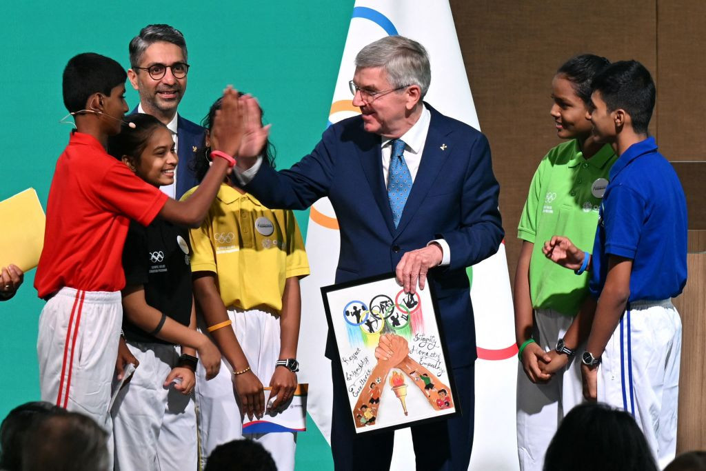 Thomas Bach with students involved in the Olympic Values Education Programme in India. GETTY IMAGES