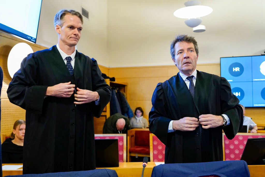 The former president of the International Biathlon Union and his lawyers in court. GETTY IMAGES