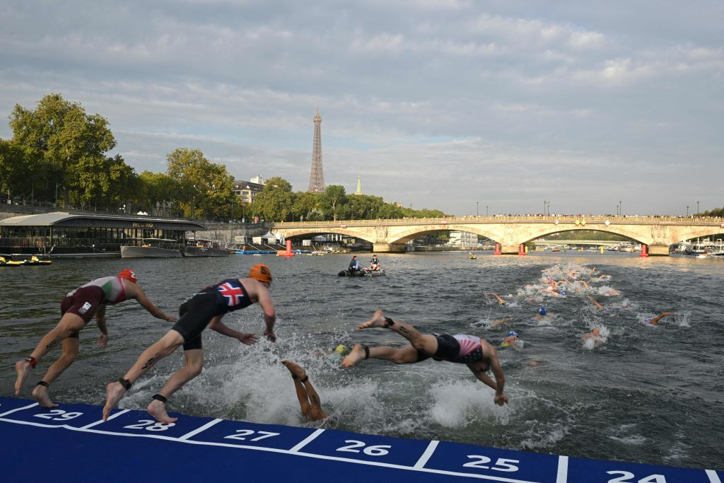 Triathlon athletes swim in the Seine river during the men's 2023 World Triathlon Olympic Games Test Event in Paris, on 18 August 2023. GETTY IMAGES