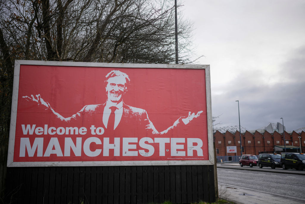 A billboard outside Old Trafford shows a picture of Man Utd's new investor Sir Jim Ratcliffe. GETTY IMAGES