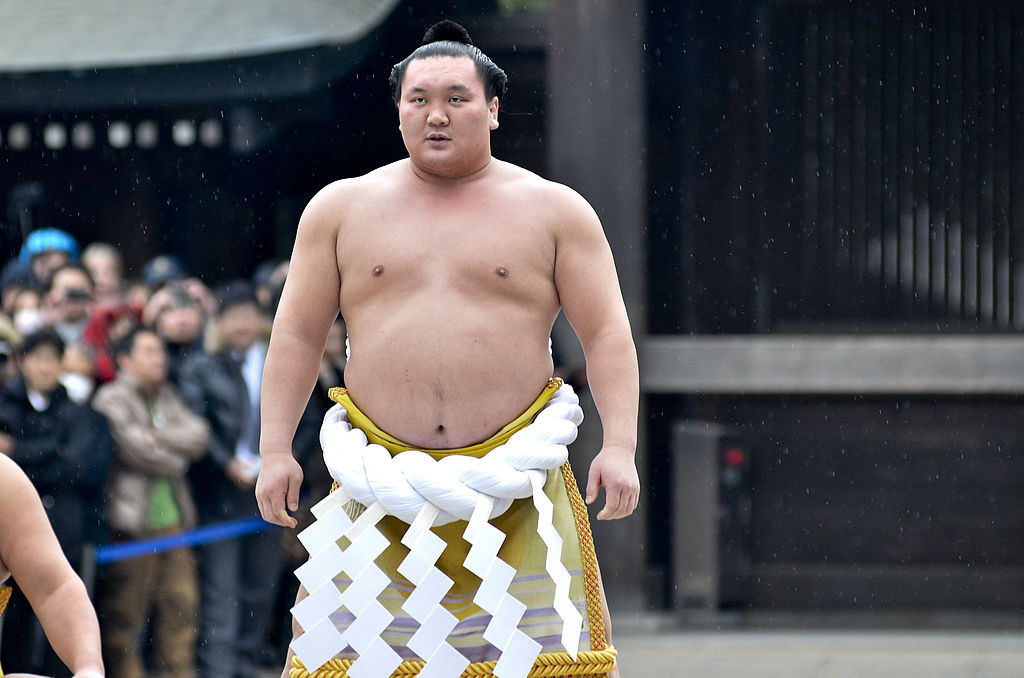 Sumo Grand Champion Hakuho performs 'Dohyo-iri'. GETTY IMAGES.